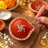 Giftcera Handpainted Swastik Clay Diyas | Orange & White | Pack of 6